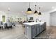 Open concept kitchen, dining and living areas with modern decor at 13279 Arnold Palmer Cir # 867, Lancaster, SC 29720