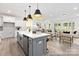 Living spaces including kitchen island and dining/living area at 13279 Arnold Palmer Cir # 867, Lancaster, SC 29720