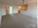 Neutral and spacious loft area with carpet at 13279 Arnold Palmer Cir # 867, Lancaster, SC 29720