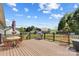 Large back deck with an umbrella, a grill, and room for outdoor dining at 140 Hazelwood Dr, Rockwell, NC 28138