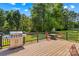 Outdoor deck features a grill, furniture, and overlooks the spacious backyard at 140 Hazelwood Dr, Rockwell, NC 28138