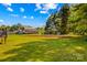 The backyard is mostly green grass with a metal structure and camper at 140 Hazelwood Dr, Rockwell, NC 28138