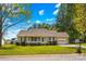 Inviting single-story home with a well-manicured lawn, charming front porch and attached garage with driveway at 140 Hazelwood Dr, Rockwell, NC 28138