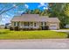 Charming single-story home featuring a cozy front porch and well-manicured landscaping at 140 Hazelwood Dr, Rockwell, NC 28138