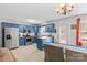 Spacious eat-in kitchen with stainless steel appliances and blue cabinetry at 140 Hazelwood Dr, Rockwell, NC 28138