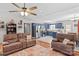 Open living area with a seamless transition to the blue-cabinet kitchen and dining space at 140 Hazelwood Dr, Rockwell, NC 28138