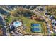 Community amenities include a pool, tennis courts, playground, and green space, all nestled among beautiful fall foliage at 14010 Promenade Dr, Huntersville, NC 28078