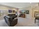 Recreation room features carpet, leather sofas, and sports memorabilia at 14010 Promenade Dr, Huntersville, NC 28078