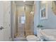 Bathroom featuring a tiled shower with glass doors and neutral tile at 14010 Promenade Dr, Huntersville, NC 28078