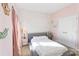 bedroom with soft pink walls and stylish animal mural feature wall at 14010 Promenade Dr, Huntersville, NC 28078