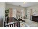 Bright Bedroom with natural light, crib, rocker, and changing table at 14010 Promenade Dr, Huntersville, NC 28078