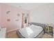 bedroom featuring a cozy bed, whimsical decor, and natural light at 14010 Promenade Dr, Huntersville, NC 28078