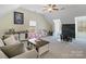 Large bonus room with ample seating, play area, and natural light at 14010 Promenade Dr, Huntersville, NC 28078