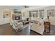 Comfortable living room boasting a stone fireplace, ample seating, and natural light at 14010 Promenade Dr, Huntersville, NC 28078