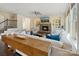 Bright living room showcasing a stone fireplace, built-in shelves, and stylish decor at 14010 Promenade Dr, Huntersville, NC 28078