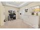 Bright home office with a Murphy bed, desk and shelving at 14010 Promenade Dr, Huntersville, NC 28078