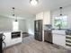 Renovated kitchen featuring stainless steel appliances, gray countertops, and tile floors at 1408 Wicker Dr, Charlotte, NC 28210