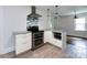 Renovated kitchen featuring stainless steel appliances, gray countertops, and tile floors at 1408 Wicker Dr, Charlotte, NC 28210