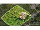 Areal view of a private home surrounded by mature trees, creating a secluded and peaceful atmosphere at 14130 Lea Point Ct, Huntersville, NC 28078