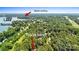 Scenic aerial view of property close to Lake Norman and Blythe Landing with mature trees at 14130 Lea Point Ct, Huntersville, NC 28078