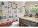 Bathroom showcasing a decorative shower curtain, updated vanity with granite top, and lake-themed decorations at 14130 Lea Point Ct, Huntersville, NC 28078