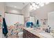 Bathroom featuring a double vanity with granite countertops, decorative shower curtain, and neutral tile at 14130 Lea Point Ct, Huntersville, NC 28078