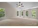 Spacious bonus room featuring neutral carpet, recessed lighting, and ample windows for natural light at 14130 Lea Point Ct, Huntersville, NC 28078
