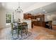 Open concept featuring a breakfast nook flowing into a spacious kitchen with custom wood cabinets at 14130 Lea Point Ct, Huntersville, NC 28078