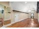 Walk-in closet featuring hardwood floors, a chandelier, and custom shelving for optimal storage at 14130 Lea Point Ct, Huntersville, NC 28078