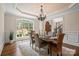 Lovely formal dining room featuring designer lighting, hardwood floors and seating for six at 14130 Lea Point Ct, Huntersville, NC 28078