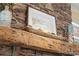 Close up on a stone fireplace with a wooden mantle and decorative accents at 14130 Lea Point Ct, Huntersville, NC 28078