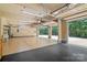 Spacious garage with painted floors, a large utility sink, and direct access to the backyard at 14130 Lea Point Ct, Huntersville, NC 28078