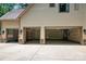Large multi-car garage featuring three bays, updated lighting, and ample storage space at 14130 Lea Point Ct, Huntersville, NC 28078