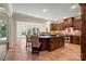 Gourmet kitchen with large island, stainless appliances, beautiful wooden cabinetry and attached breakfast room at 14130 Lea Point Ct, Huntersville, NC 28078