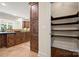 Gourmet kitchen features a tall pantry and view into a large, open, well-lit, kitchen and breakfast room at 14130 Lea Point Ct, Huntersville, NC 28078