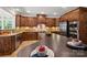 Spacious kitchen boasts stainless steel appliances, custom cabinets, and a large curved island at 14130 Lea Point Ct, Huntersville, NC 28078