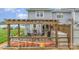 Back deck featuring a pergola, patio seating, and outdoor grilling area at 1424 River Dr, Belmont, NC 28012