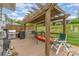 Back deck featuring pergola, privacy fence, outdoor grill, and patio seating at 1424 River Dr, Belmont, NC 28012