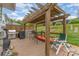 Back deck featuring pergola, privacy fence, outdoor grill, and patio seating at 1424 River Dr, Belmont, NC 28012