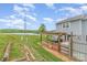 Inviting backyard with a deck, pergola, and lake views, perfect for outdoor entertaining at 1424 River Dr, Belmont, NC 28012