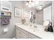 Bright bathroom featuring a vanity with storage, a framed mirror, and coordinated decor at 1424 River Dr, Belmont, NC 28012