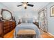 Comfortable bedroom with hardwood floors, area rug, and stylish decor at 1424 River Dr, Belmont, NC 28012