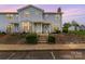 Charming townhome featuring a tidy front yard, steps leading to the entrance, and a welcoming porch at 1424 River Dr, Belmont, NC 28012