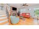 Inviting living room featuring a cozy brick fireplace and hardwood floors at 1424 River Dr, Belmont, NC 28012