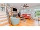 Inviting living room featuring a cozy brick fireplace and hardwood floors at 1424 River Dr, Belmont, NC 28012