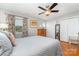 Inviting main bedroom with a bed, hardwood floors, large windows, and closet space at 1424 River Dr, Belmont, NC 28012