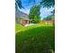 Large, well-manicured backyard with a swimming pool and plenty of seating at 15003 Jerpoint Abby Dr, Charlotte, NC 28273