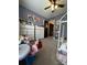 A ' bedroom with carpet, ceiling fan, and ample storage and display furniture at 15003 Jerpoint Abby Dr, Charlotte, NC 28273