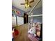 Spacious bedroom with a canopy bed, plenty of toy storage, and a playful atmosphere at 15003 Jerpoint Abby Dr, Charlotte, NC 28273