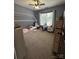 Cozy bedroom with carpet, a bed frame, a window, and a storage dresser at 15003 Jerpoint Abby Dr, Charlotte, NC 28273
